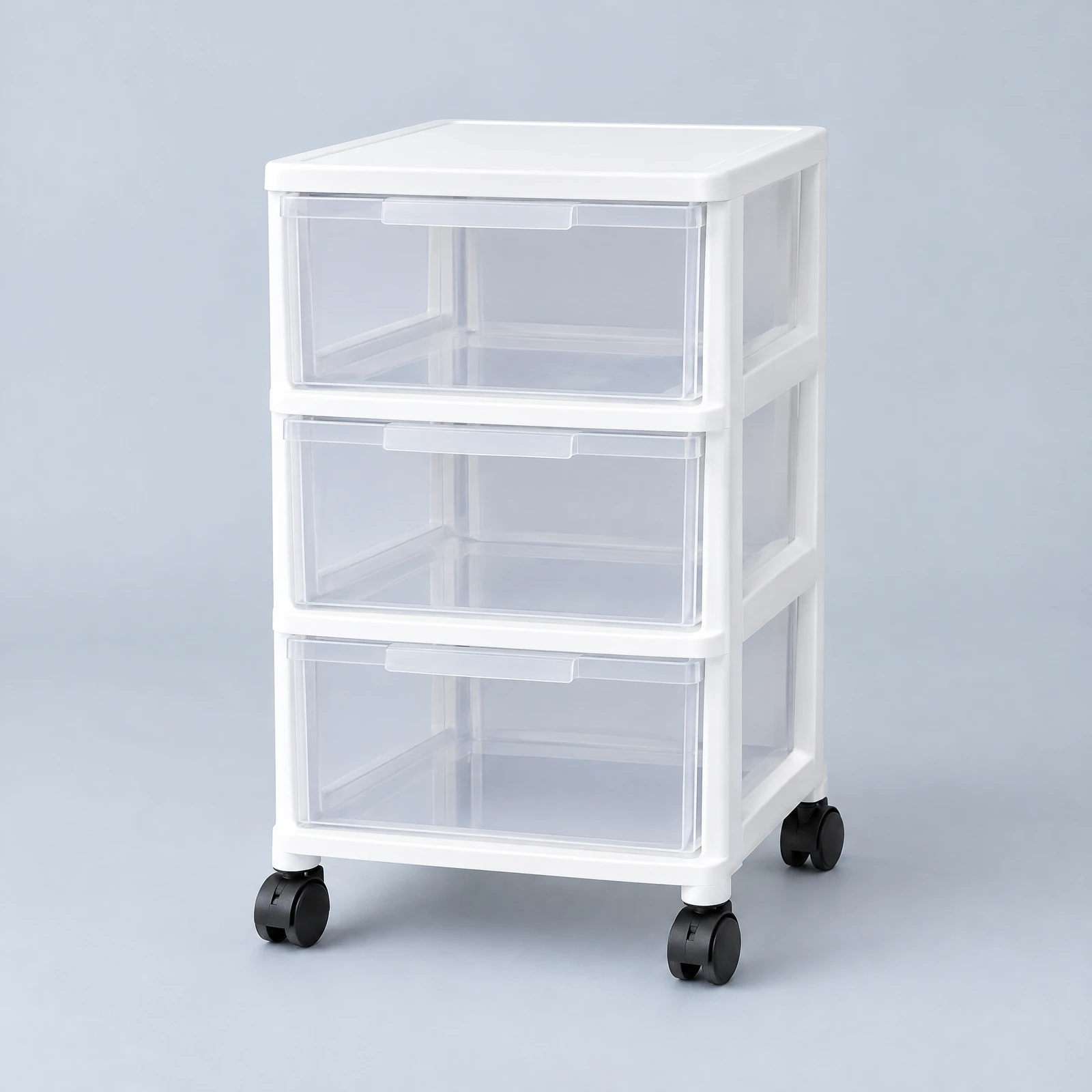 White rolling three-drawer cart with clear drawer fronts on four casters